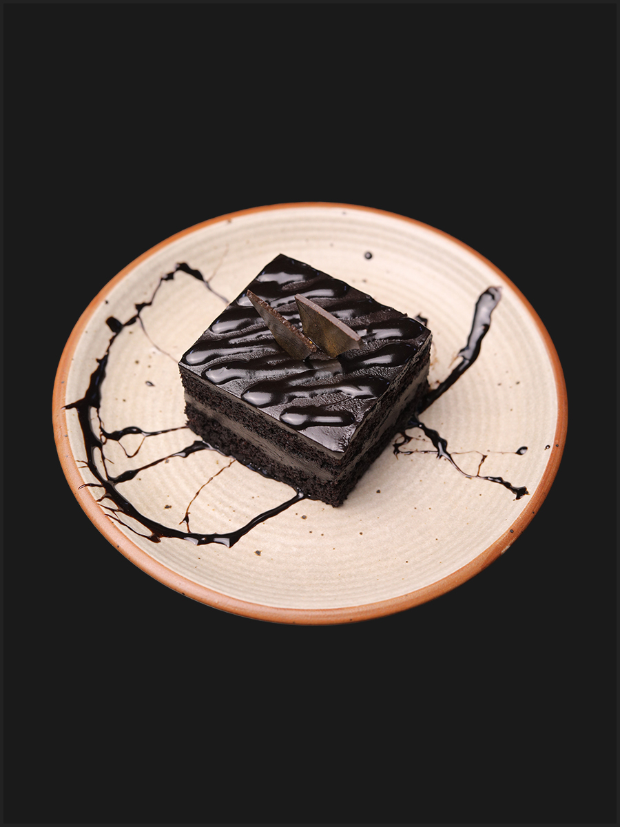 Chocolate Truffle dessert plated with chocolate sauce