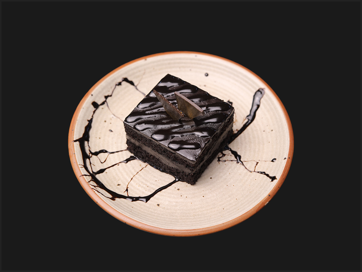 Chocolate Truffle dessert plated with chocolate sauce
